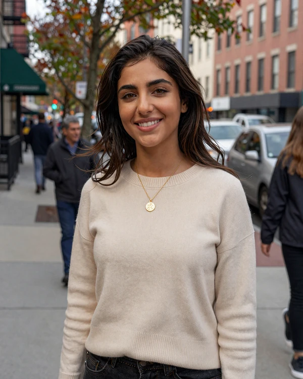 Afghan-American woman smiling confidently on an American city street - meet Afghan women in the US through our dating platform